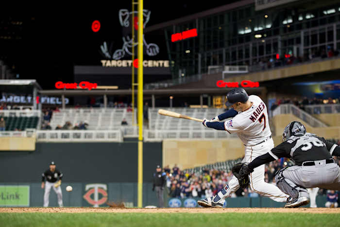Apr 12, 2018; Minneapolis, MN, USA; Minnesota Twins first baseman Joe Mauer (7) singles in the seventh inning against Chicago White Sox for his 2000th career hit at Target Field.